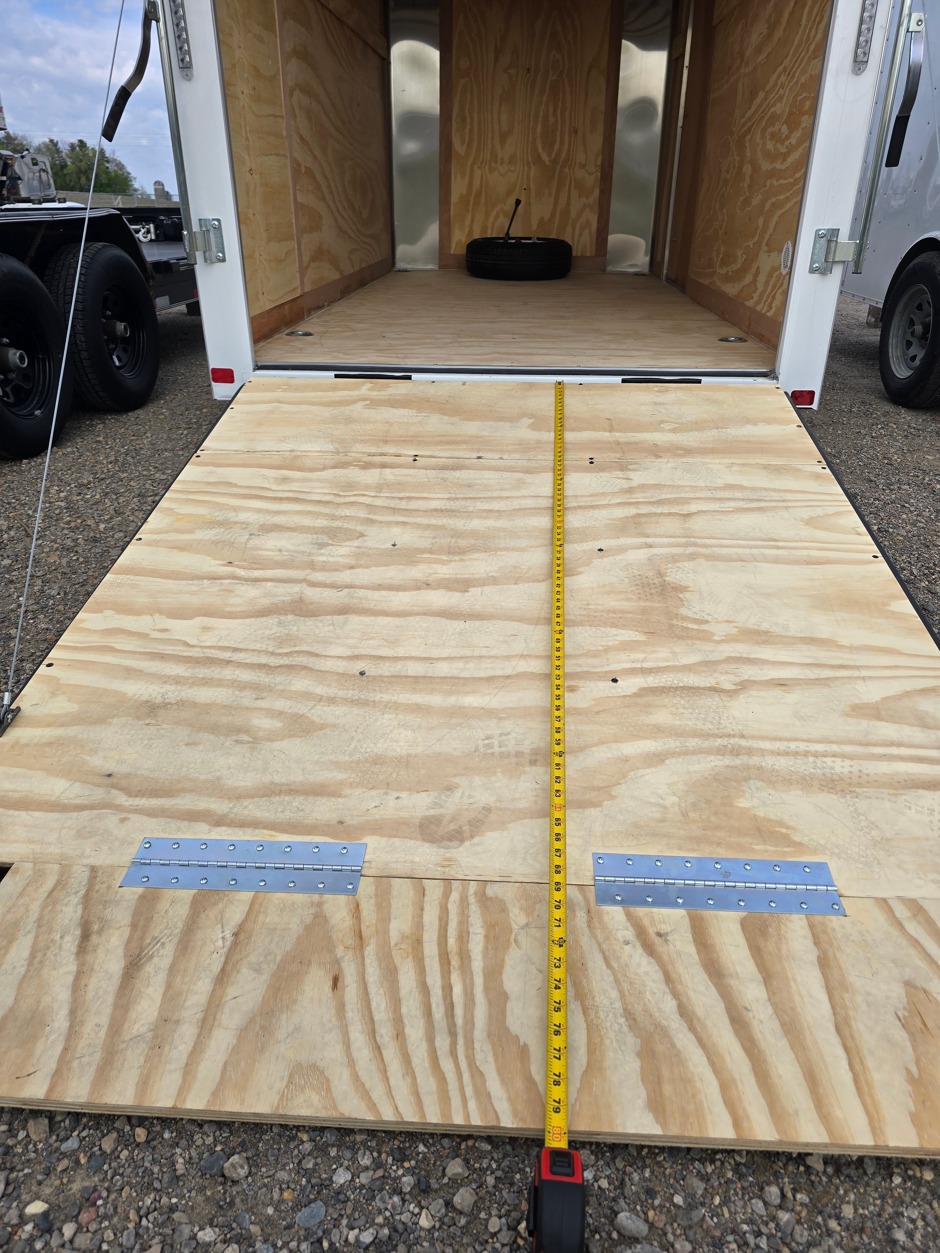 6x12 enclosed trailer interior with loading ramp extended for easy access